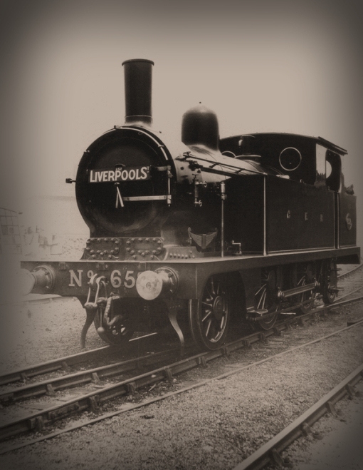For many reasons this photo is an absolute gem. For a start it is the only one I'm aware of which shows one of the first ten M15s in Worsdell's as-built condition, and the early-style lamp sockets on the bufferbeam and brackets on the smokebox date the photo to not later than c1886. The cylinder covers below the smokebox door are prominent and reminiscent of the NER A Class. The Roscoe displacement lubricator on the smokebox side and separate boiler handrails with the Westinghouse exhaust pipe running over the top of the tank from cab to smokebox are features of the period. Only four of the eight possible bolt holes on the parallel buffer housings have been utilised - hollow spindle buffers are fitted as are under-hung Westinghouse hoses. The destination boards at this time were assigned to specific locomotives, evidenced by the running number on them. Worsdell's small 4" GER lettering on the tank side is noticeable. Fascinating to see that even at this early date there is considerable loss of paint from the front and sides of the smokebox and door due to working the engine hard. 